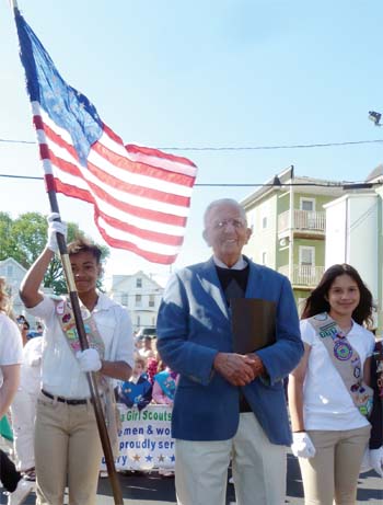 Pictured at the Memorial Day Parade are Parade Marshal and World War II veteran Morris Seigal with two Girl Scouts from the Chelsea troop.